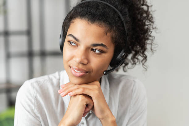 istock African American young lady wearing a headset 1300321549