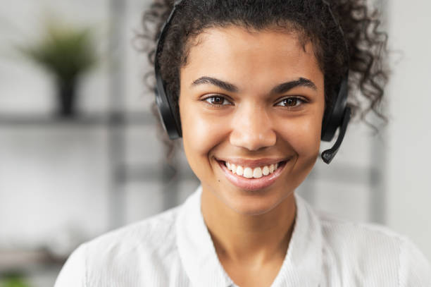 istock African American young lady wearing a headset 1300321563