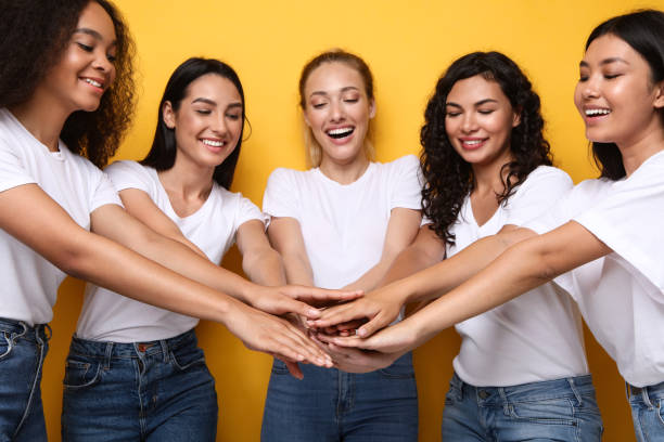 istock United Multicultural Women Holding Hands Standing Together In Studio 1300323192