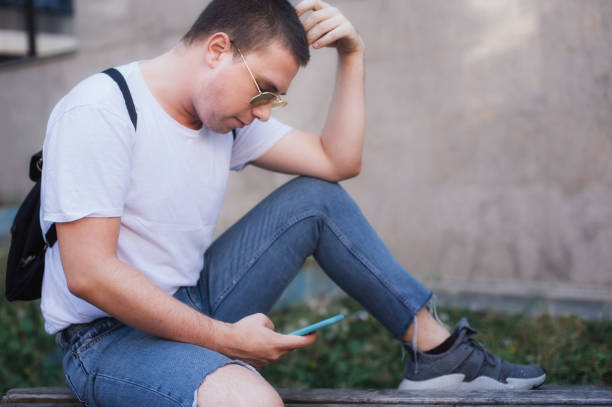 istock Man using smart phone connect communication. Emotional isolation, technology depresion 1300324034