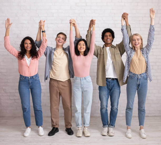 istock Teamwork, support from friend in studies and emotions of success 1300324187