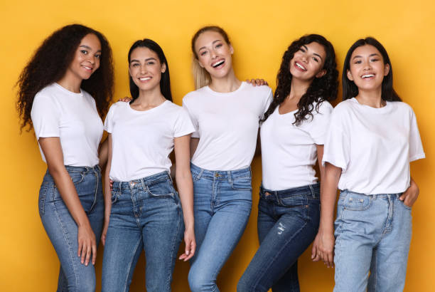 istock Five Cheerful Young Ladies Posing On Yellow Background, Studio Shot 1300324436