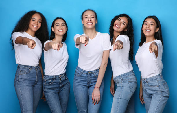 istock Multiethnic Women Pointing Finger At Camera Choosing You, Blue Background 1300324461