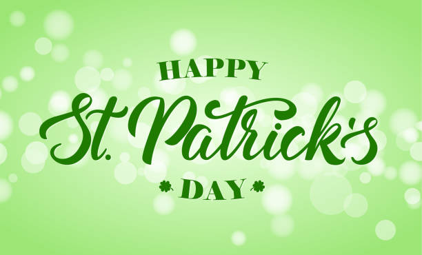 istock Handwritten elegant modern brush letteringof Happy St. Patrick's Day on green bokeh blurred background. 1300325504