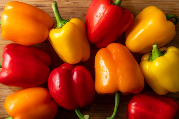 istock Orange, red and yellow bell peppers 1300326343