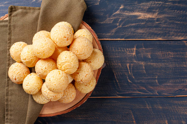 delicious brazilian cheese bread. also known in latin america as chipa, pan de bono and pan de yuca. - cooked bread food cup imagens e fotografias de stock