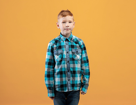 Basic Ginger Kid Handsome Ginger Kid Posing On Yellow Studio Background Stock Photo ...