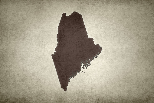 Grunge map of the state of Maine (USA) printed old paper.