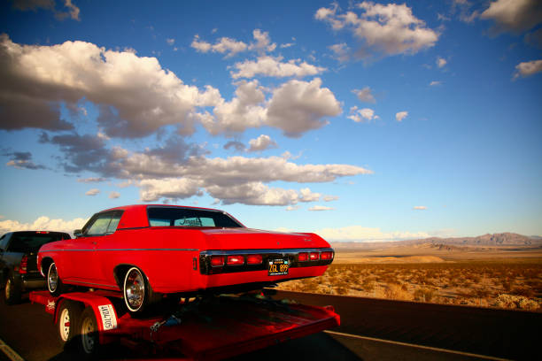 Blue car is moving along the American highway