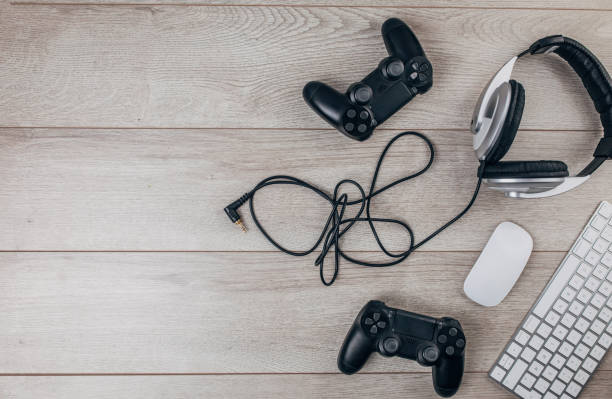 Video gaming setup on wooden background