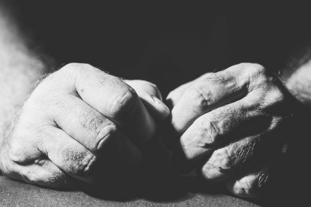 istock black and white photograph two relaxed hands 1300331102
