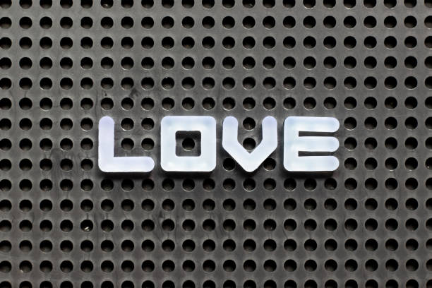 istock White color letter in word love on black pegboard background 1300331106