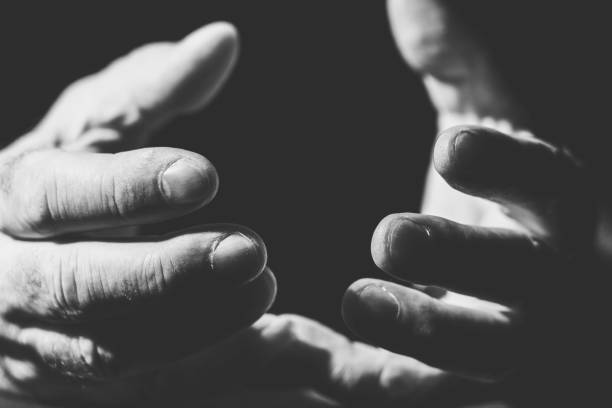 istock close-up of two hands embracing or asking something 1300331268