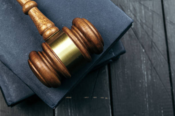 istock Image of wooden judge hammer on notepad 1300332764