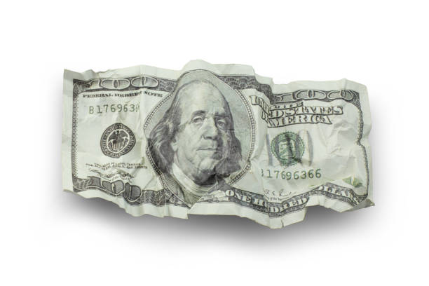 istock Money crushed one hundred dollar bills isolated 1300333239
