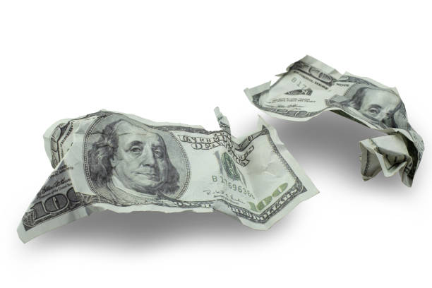 istock Money crushed one hundred dollar bills isolated 1300333244