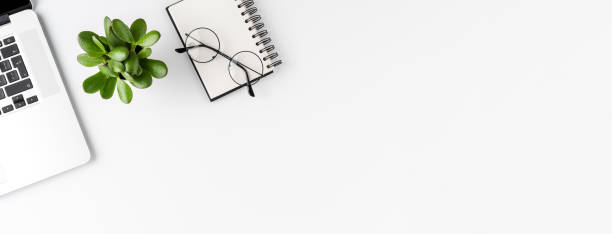 istock Modern workspace with laptop and business accessories. Office desktop with copyspace. Banner 1300335045