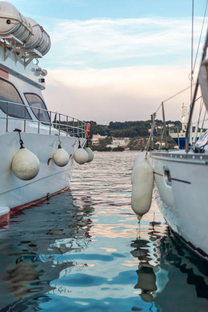 Small motorboat at the dock with beautiful reflections in the water.