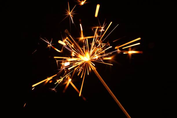 istock Sparkler close-up on a black background 1300337646