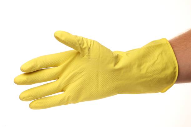 istock Yellow household mittens on a white background 1300337665
