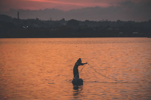 istock Fisherman, Nets and Golden Sky 1300339154