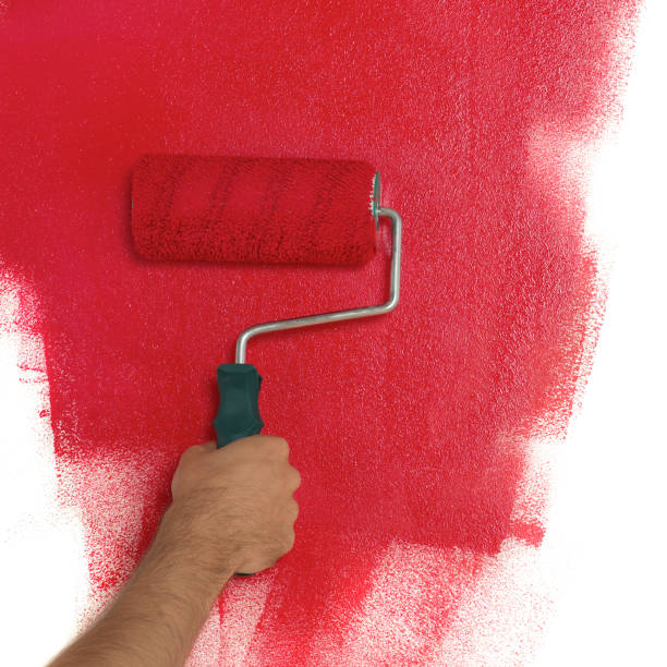 istock Painting the wall 1300340052