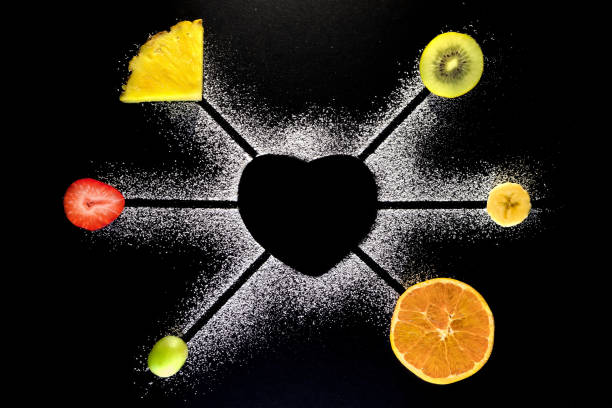 Heart with fresh fruits and black background