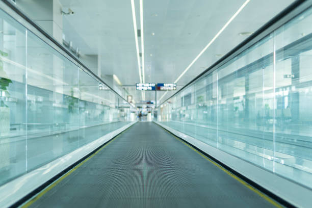 istock Motion of airport moving walkway 1300344942