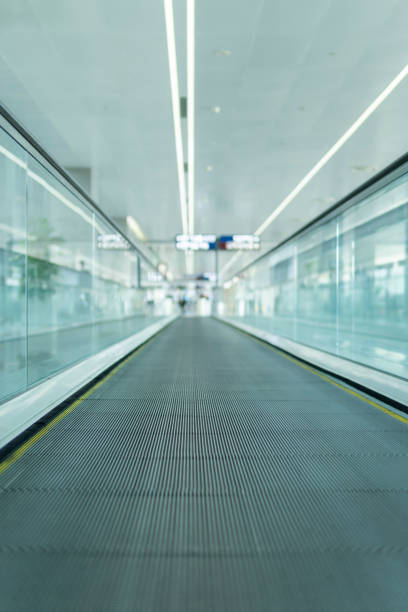 istock Motion of airport moving walkway 1300345018