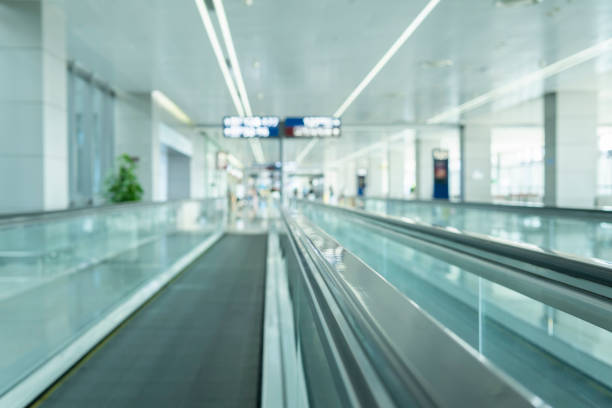 istock Motion of airport moving walkway 1300345049
