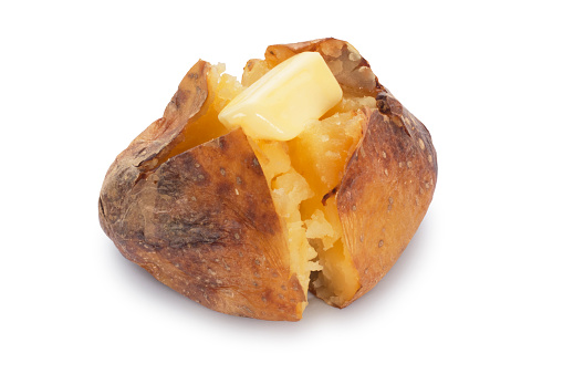 Studio shot of a baked potato cut out against a white background.