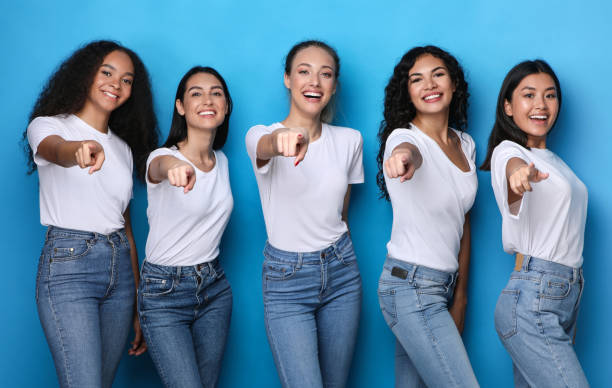 istock Group Of Multicultural Ladies Pointing Fingers At Camera, Blue Background 1300346350