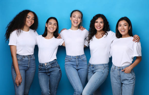 istock Diverse Females Group Smiling Posing In Studio On Blue Background 1300346483