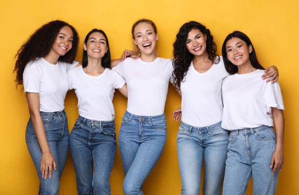 Group Of Five Mixed Ladies Hugging Posing Together In Studio