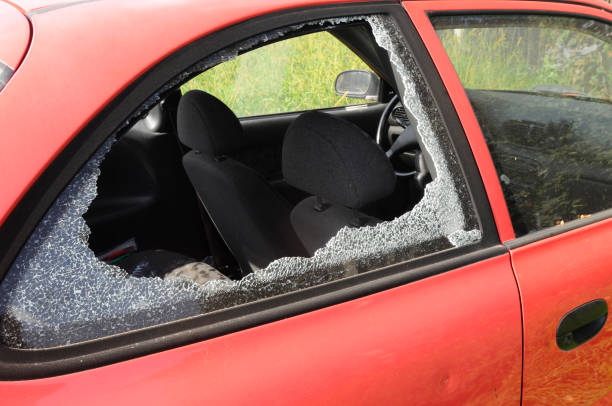 istock breaking into a car, car theft 1300347495