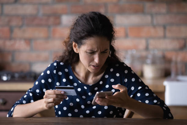 istock Unhappy woman have problems paying online on cell 1300347632