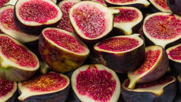 istock Tasty figs background. Top view. 1300348985