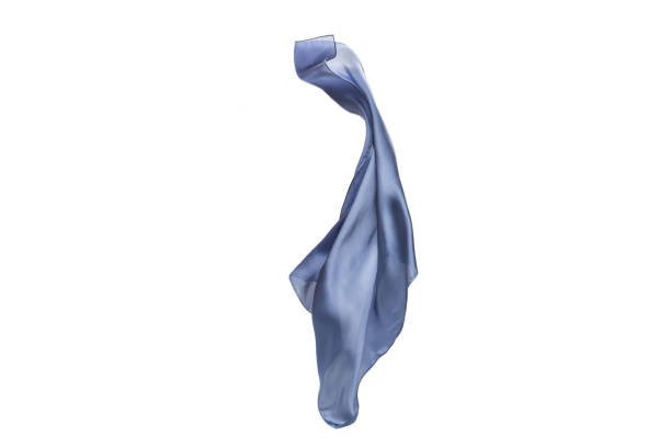 istock Flowing blue silk scarf isolated on white background. 1300349092