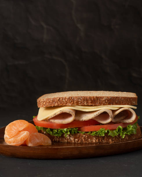 istock Healthy sandwich on black background, vertical 1300349228