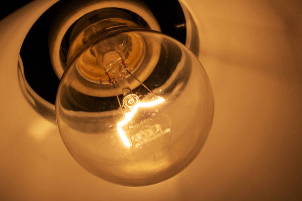 Glass bulb in the dark clsose up, light in the dark