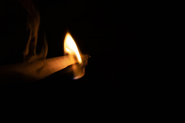 istock Burning paper in the dark close up 1300350270