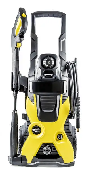 Pressure Washer Isolated on White Background. Professional High-Pressure Tool Car Cleaning Yellow-Black Color. High Pressure Washer Machine. Electric Household Appliances. Front View Close-Up.