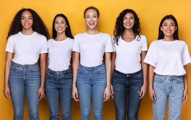 istock Group Of Five Cheerful Diverse Ladies Posing Over Yellow Background 1300352329