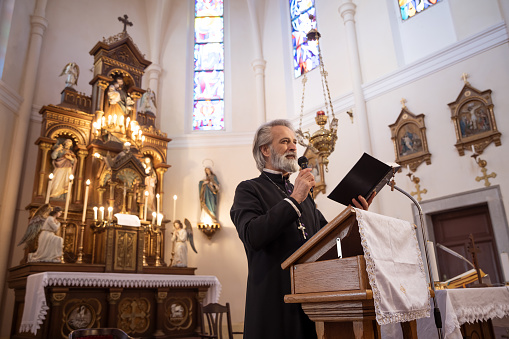 Priest having mass in church