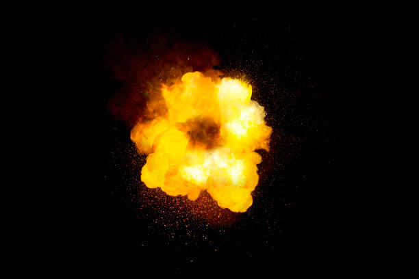 istock Fiery super bright bomb explosion, orange color with sparks and smoke isolated on black background 1300354126