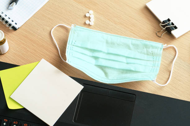 istock Medicine bottle on an office table with laptop 1300355544