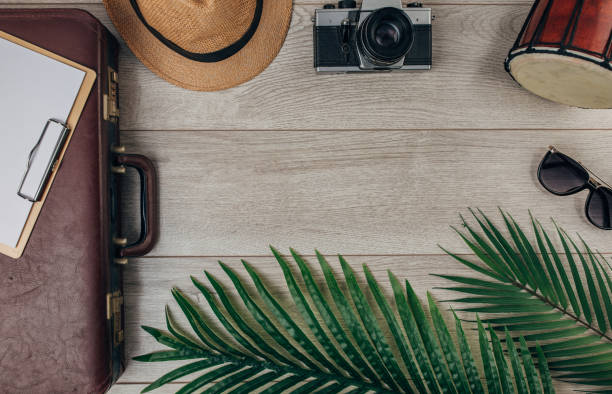 istock Travel equipment on wooden background 1300356773