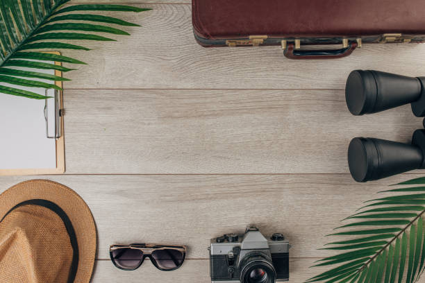 Travel equipment on wooden background