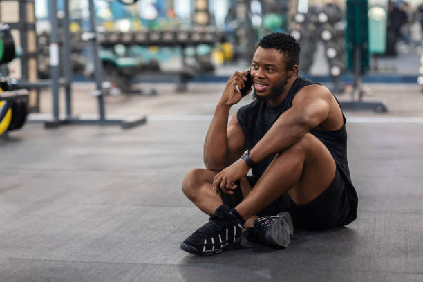 istock Smiling african american athletic man resting after workout 1300359345