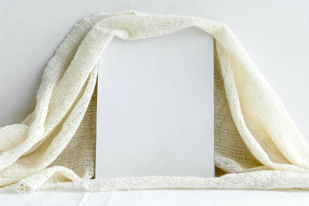 istock Blank white greeting card on white background. Wedding romantic background for the invitation. 1300360656
